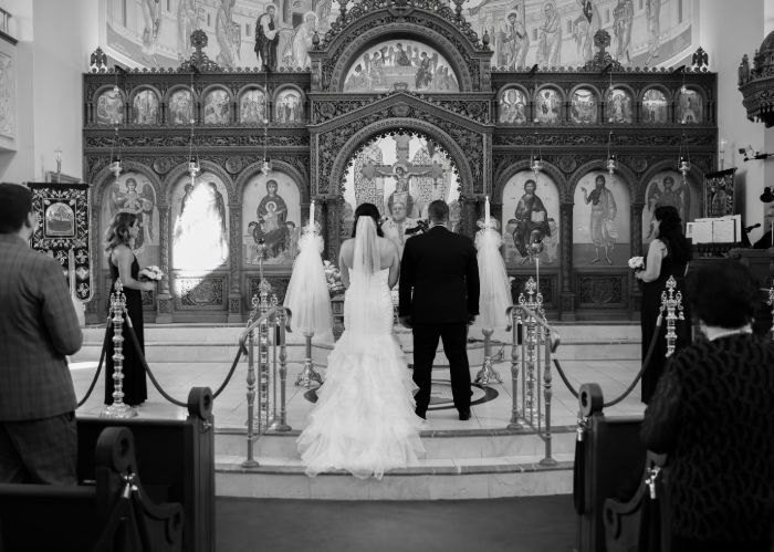 Canadian Wedding Photographer image of a Greek Bride and Groom in Church.