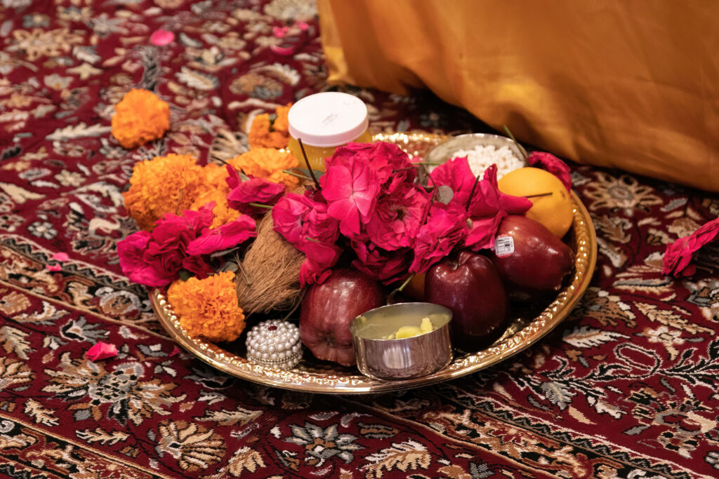 Indian wedding photography. Flowers and food offerings.