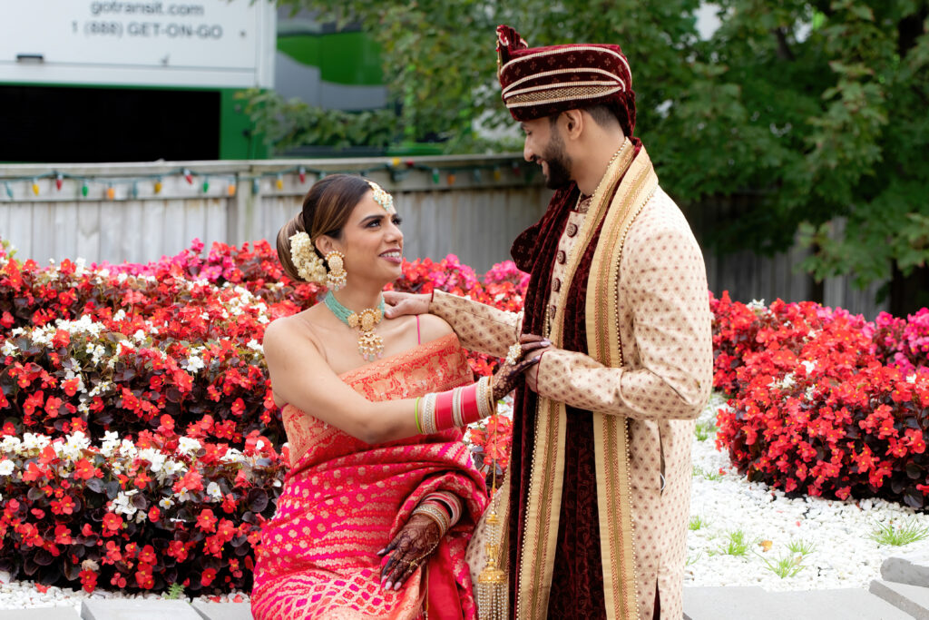 Indian Wedding Photography Brampton. Indian Bride and Groom. Outside Portrait with beautiful flowers.