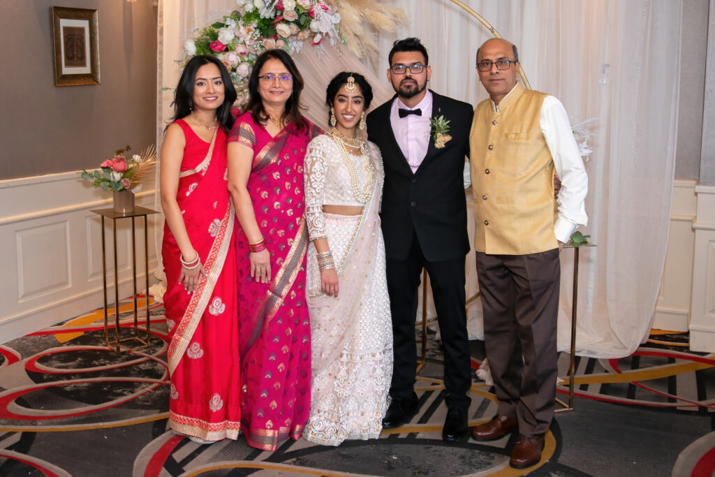 Indian Wedding photography. Bride and Groom with Family.