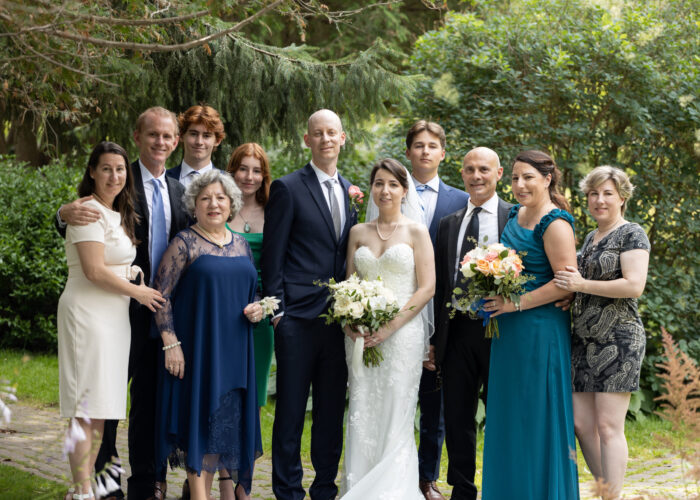 Wedding Photos Toronto. Garden Wedding pose. Bride with Groom and family.
