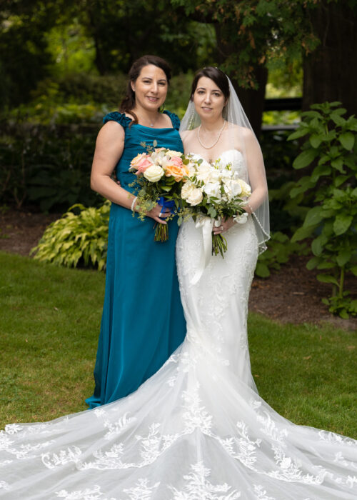 Wedding Photography Brampton. Garden image. Bride and Sister.