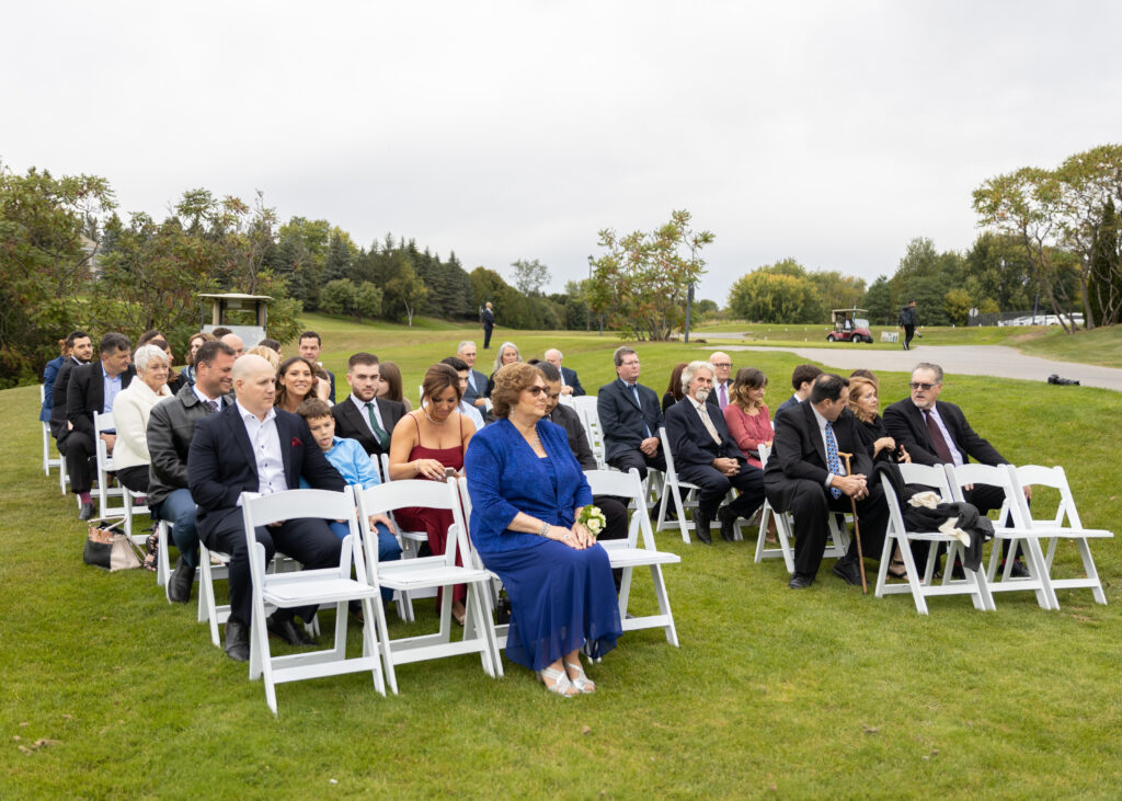 Wedding Photography. Group image of seated Wedding guests.