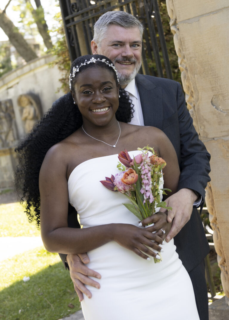 Beautiful Jamaican Wedding Photography. Bride and Groom portrait with flowers.