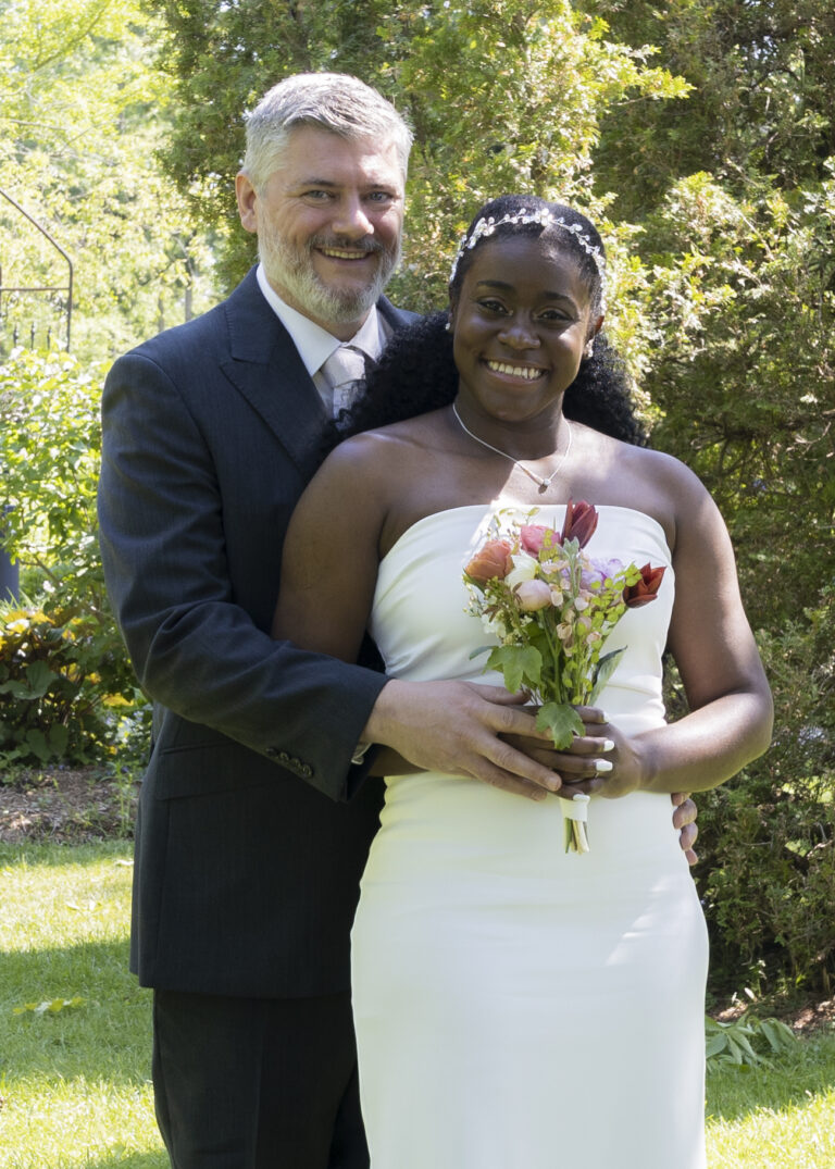 Happy Jamaican couple during their Wedding Day in a Park.